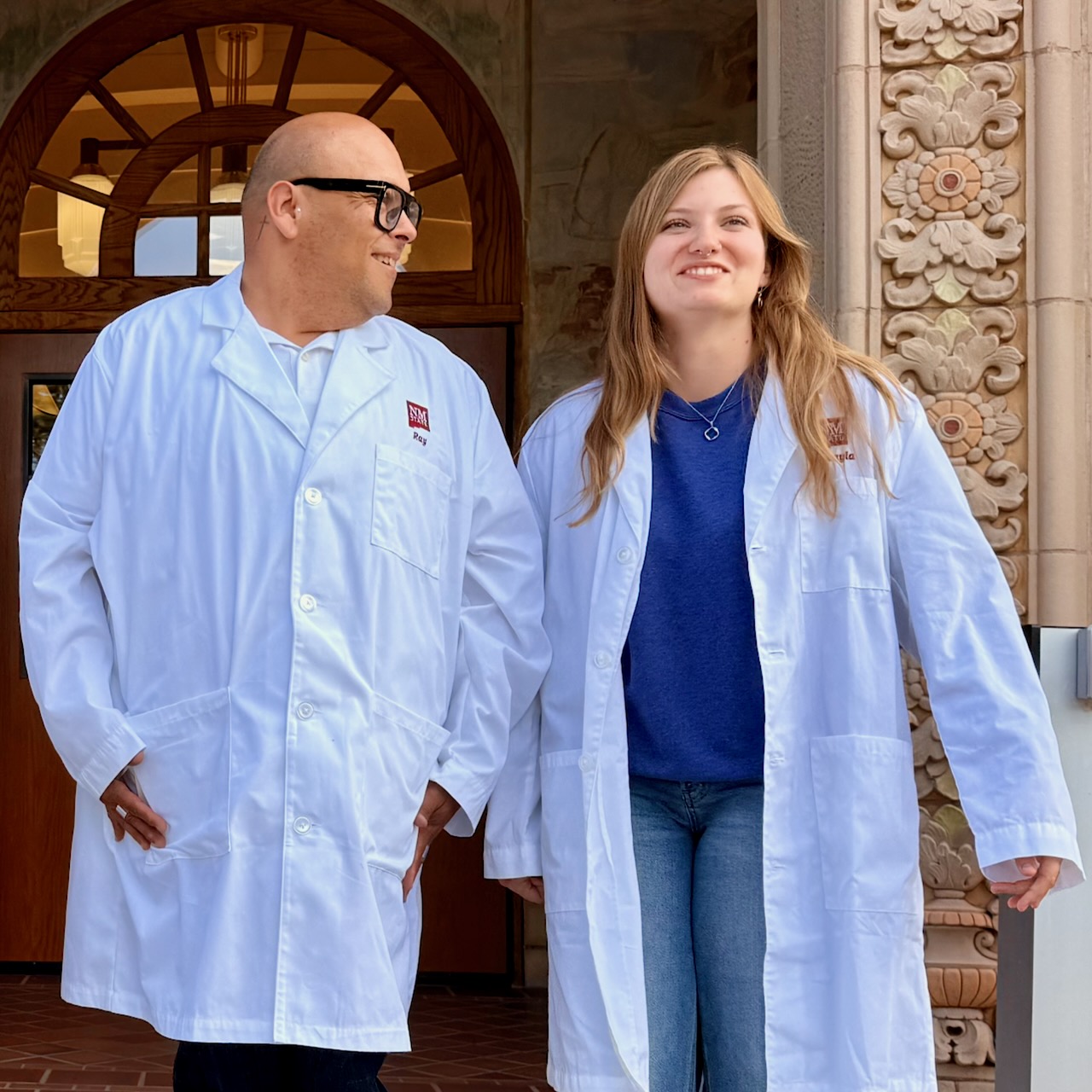 Two students in front of foster hall